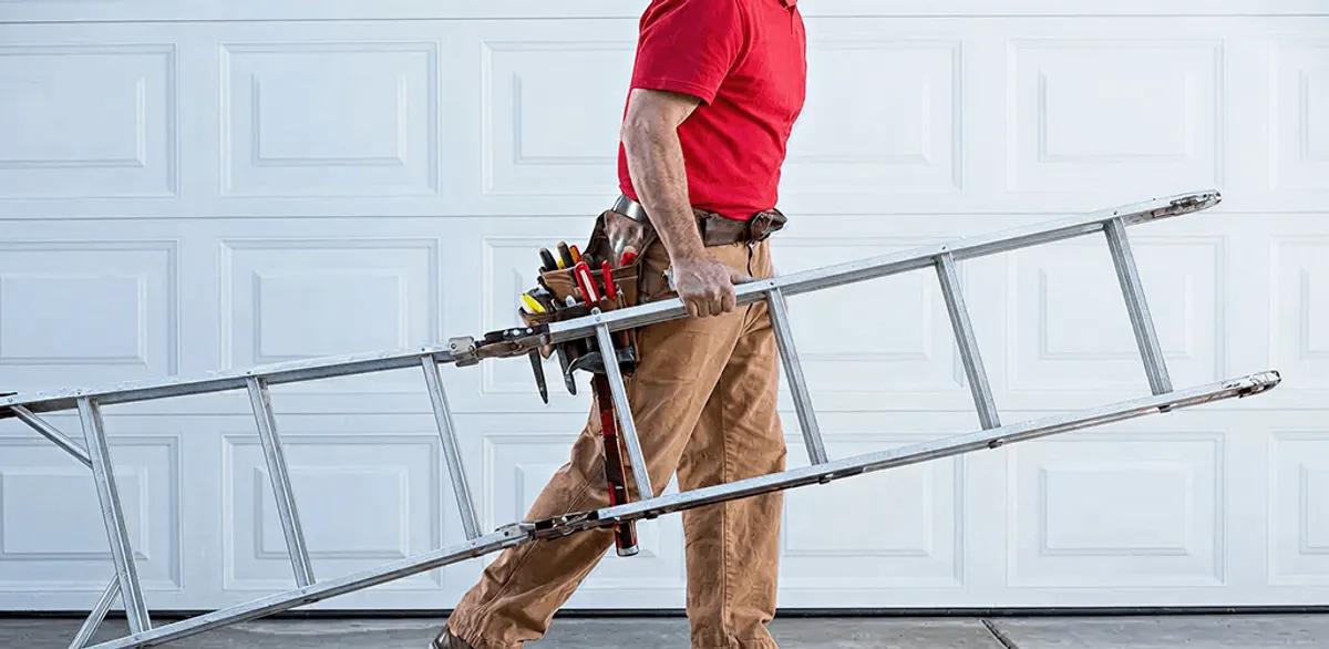 Garage door repair technician arriving with tools and ladder in Shreveport, LA
